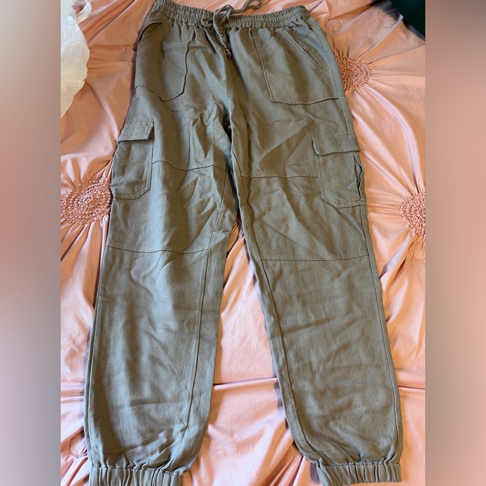 Beige joggers, never worn. Willing to negotiate price. Bought for $44.00